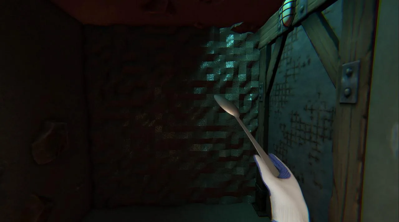 Prison Spoon Escape view of a brick wall, metal door, and spoon in an underground passage